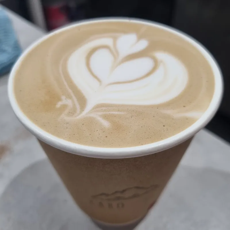 Latte art heart in Kabo Coffee branded cup